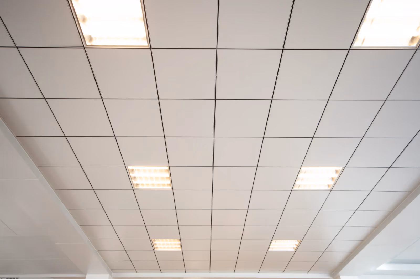 Clean white metal ceiling grid in a controlled environment
