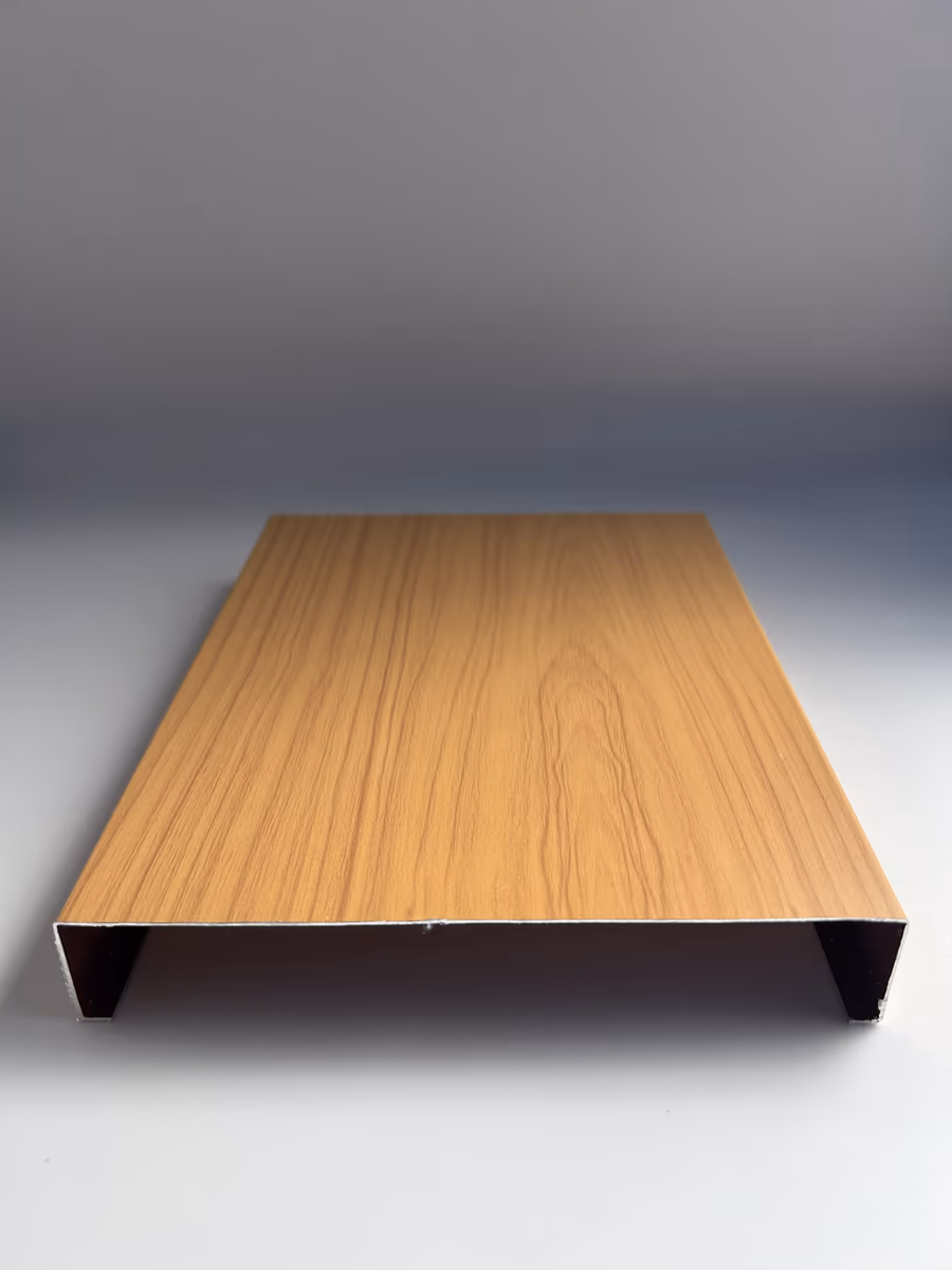 Cut sample of a 6" wide H-shaped aluminum strip panel seen end-on, showing its profile