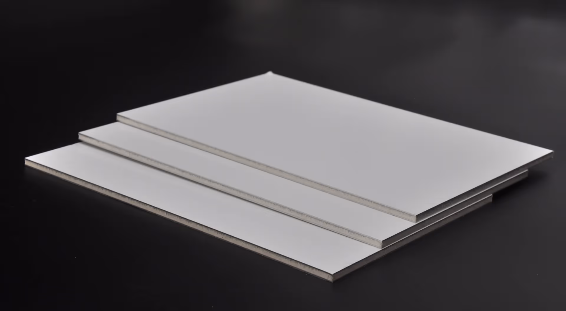 A2 fire-resistant composite panels stacked against a dark ground