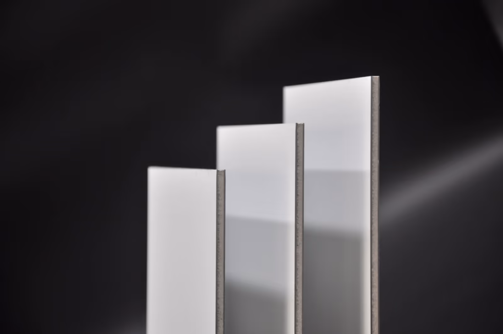 Finished A2 panel edges standing on a dark surface