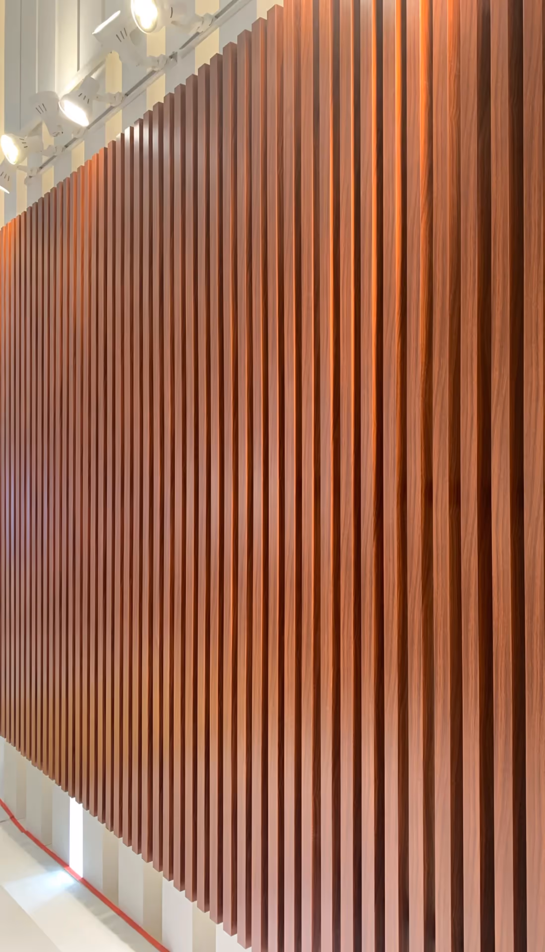 Wood grain transfer printed extruded baffles seen face on
