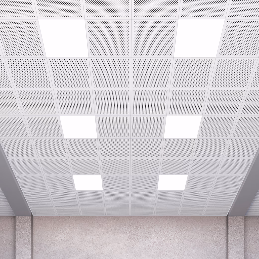 Perforated lay-in panels installed in a ceiling grid