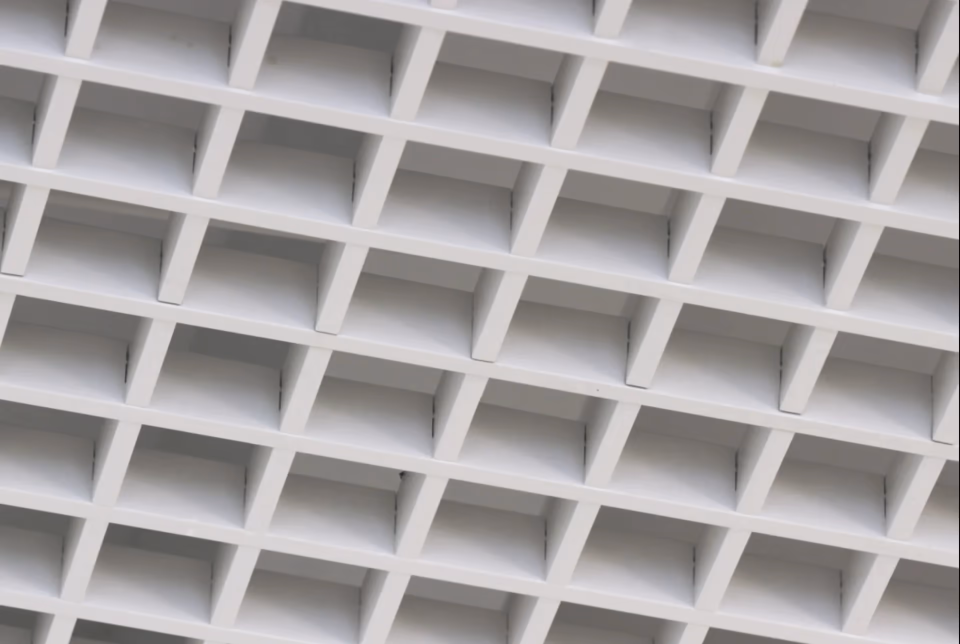 White open cell ceiling grid seen from below