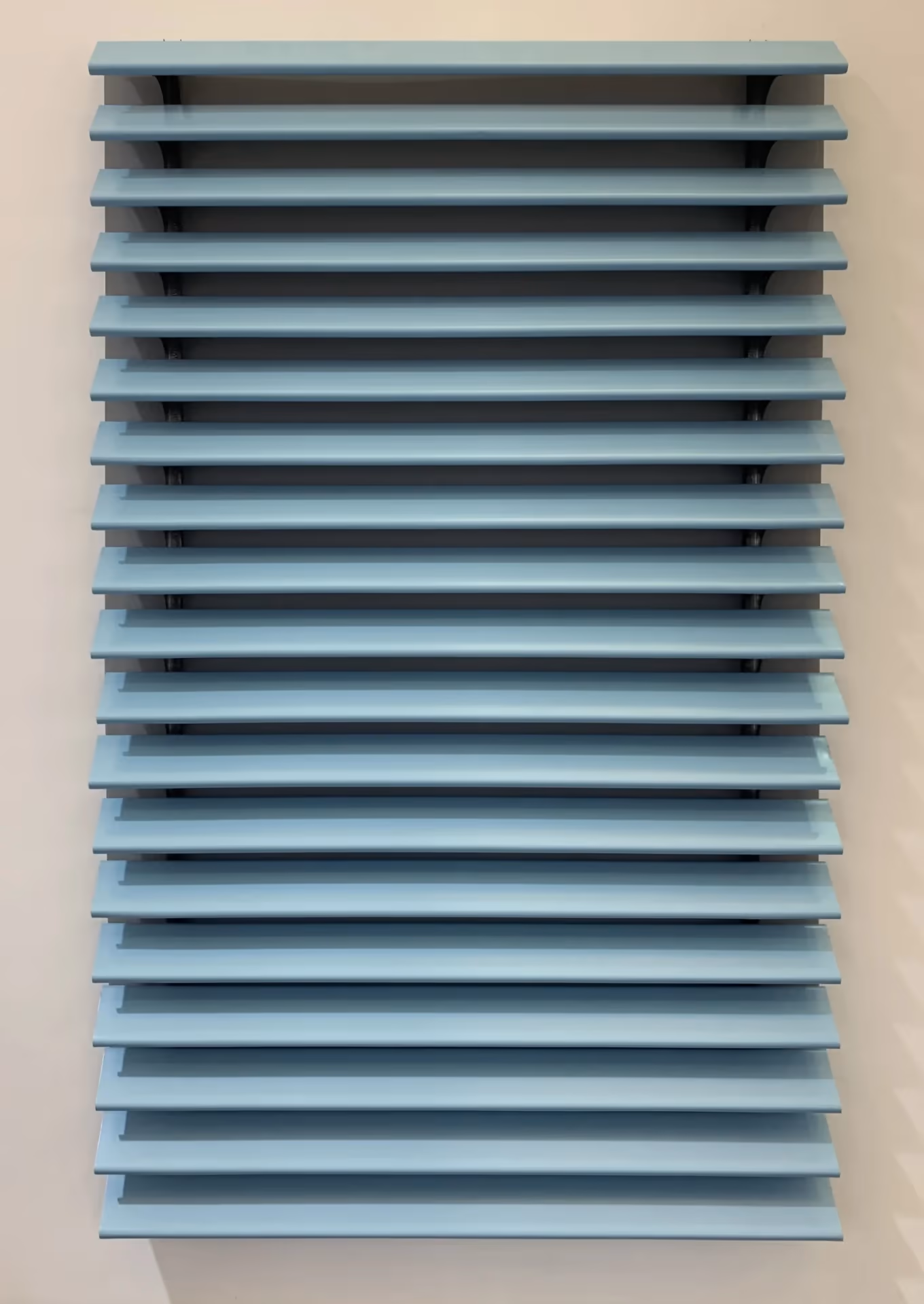 Pale blue strip ceiling panels with open gaps between them