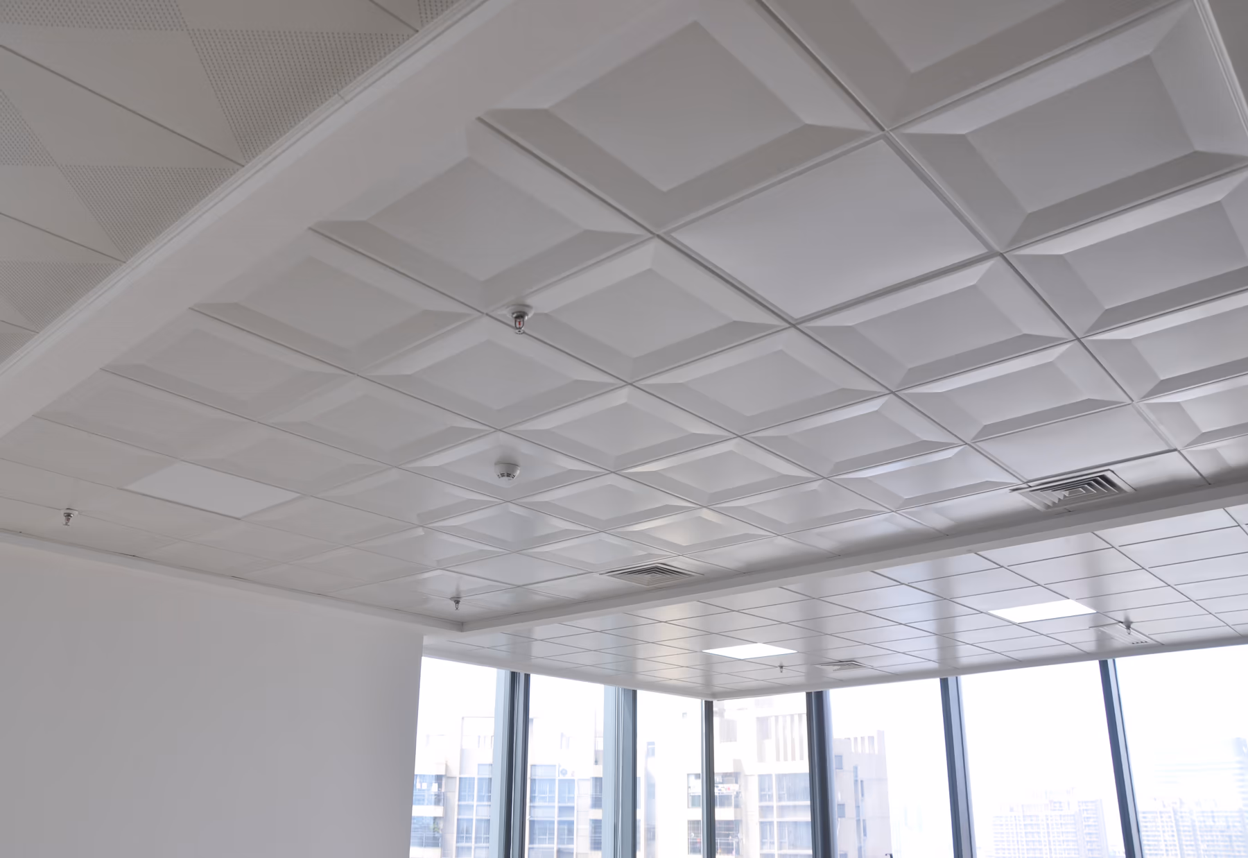 Talent clip-in ceiling installed across an open office with recessed lighting